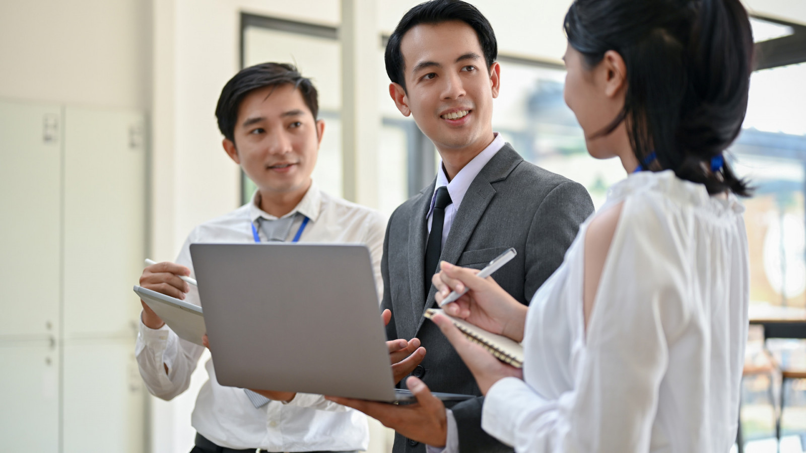 Employees exchange information during a company training session.